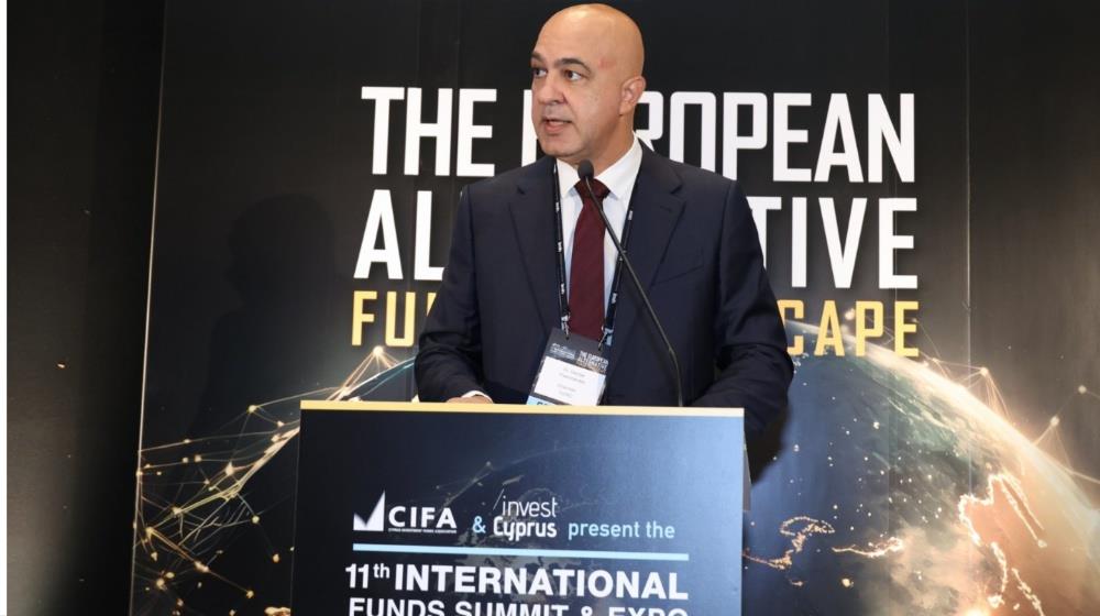 George Theocharides, Chairman of the Cyprus Securities & Exchange Commission, is speaking at a podium during the 11th International Funds Summit & Expo.