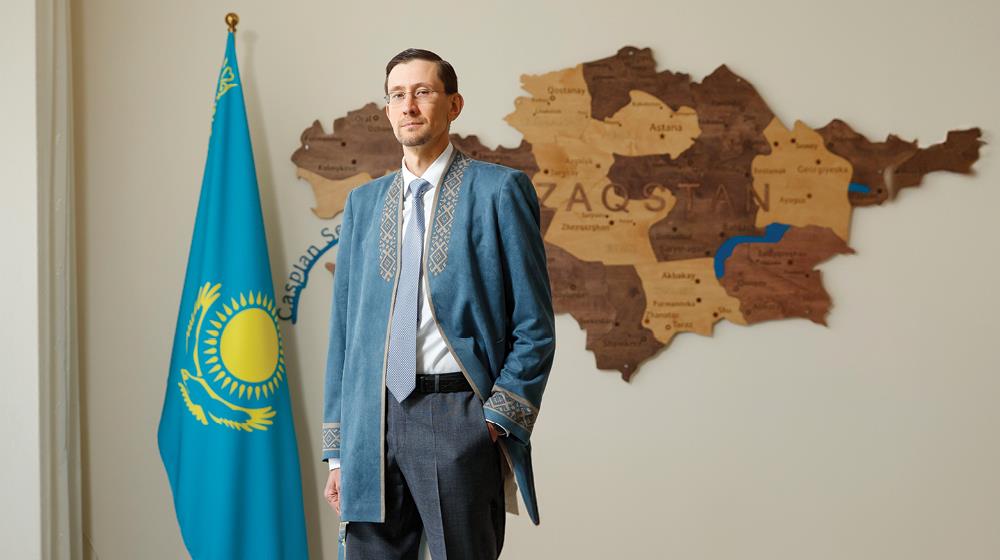 Kazakhstan's Ambassador to Cyprus, Nikolay Zhumakanov, wearing a traditional Kazakh chapan coat at the Kazakhstani Embassy in Nicosia, photographed for his GOLD magazine interview on deepening Kazakhstan–Cyprus investment and trade relations, December 2025.