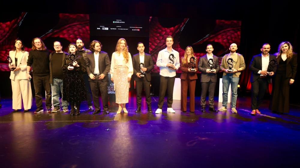 Award winners holding dragon trophies on stage at the 2nd CBN Young Dragon Awards ceremony, held at Nicosia Municipal Theatre on 19 February 2026, presented by Cyta Business.