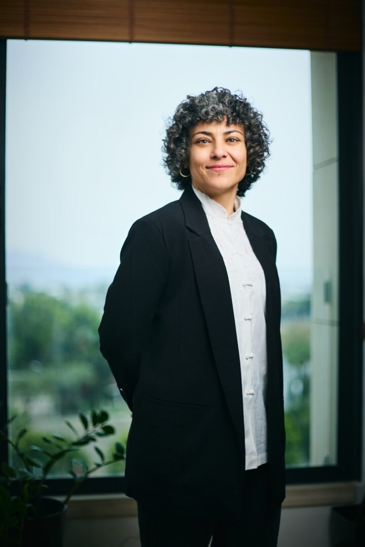 Afroditi Karagiorgi, Office Administrator at Invest Cyprus, in an office portrait photograpgh, April 2026.