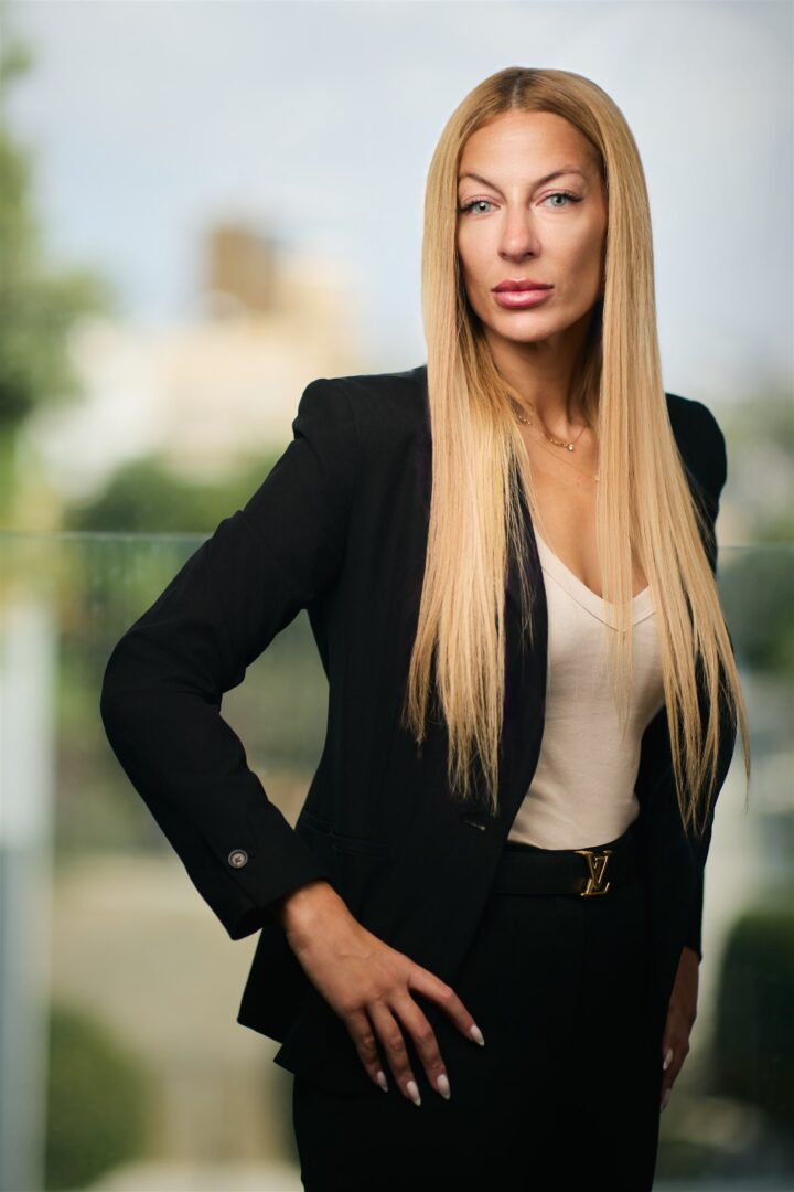 Manthia Kyriacou, Investment Promotion Associate at Invest Cyprus, in an office portrait photograph, April 2026.